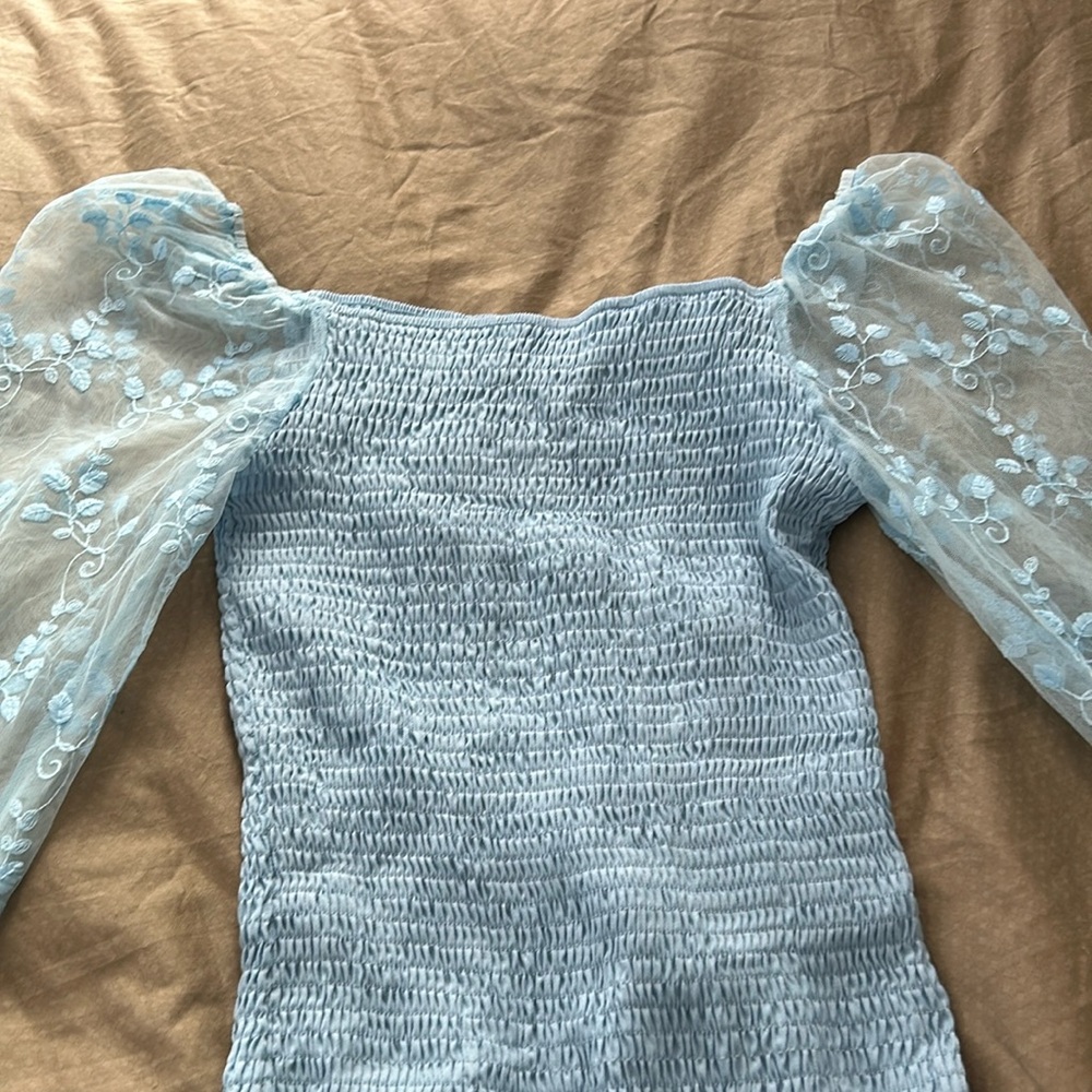 Beautiful blue easter dress. Worn ONCE. Gently used. No rips or tears.